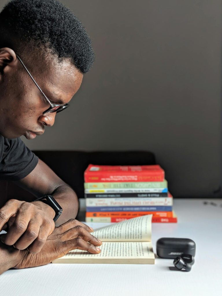 a young man on the table studying